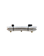 Decorative sofa bench in tuape with black leather and gold accents on a white background